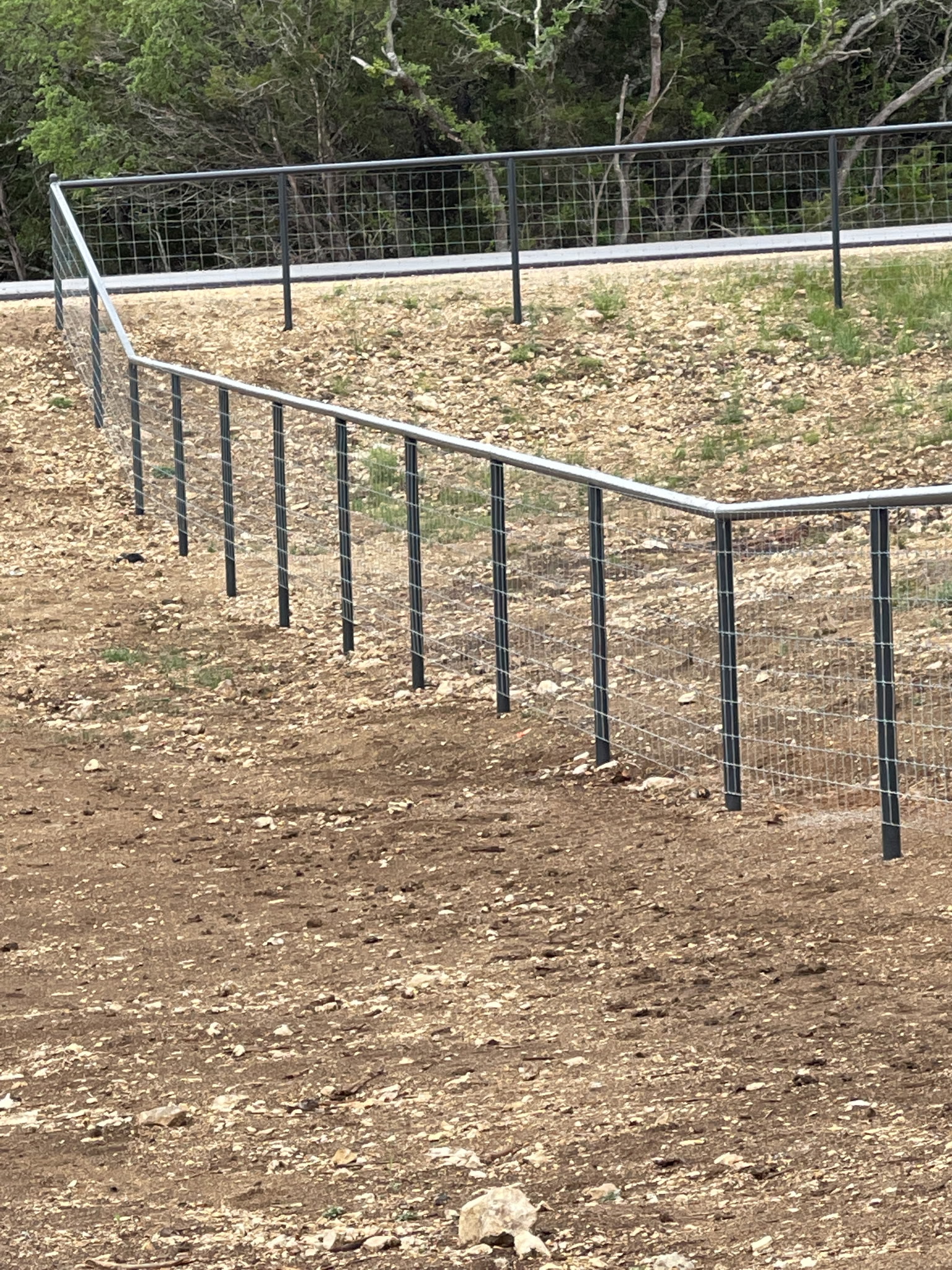 Wire fence on hillside